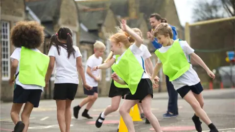 SolStock/Getty children playing in playground