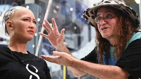 SingularityNet Dr Ben Goertzel with Sophia robot