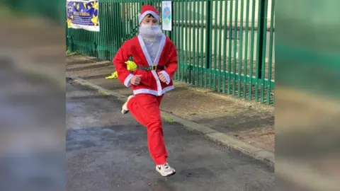 Leanne Brooking Oliver running in Santa suit