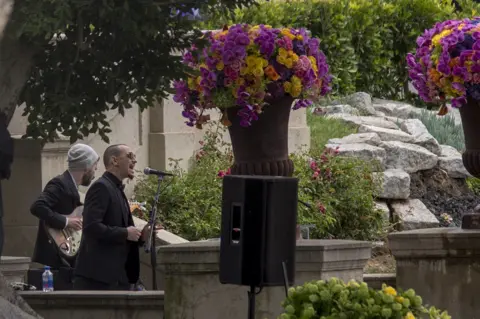 Getty Images Brad Delson and Chester Bennington perform during funeral services for Soundgarden frontman Chris Cornell at Hollywood Forever Cemetery on May 26, 2017 in Hollywood, California.