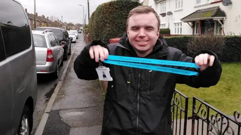 Facebook / Cal's Delivery Service Cal with his bespoke lanyard