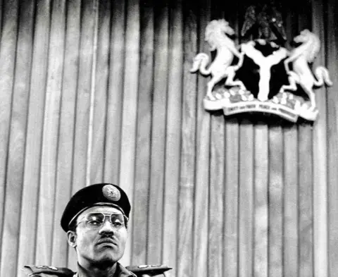 Sunmi Smart-Cole A photo by Sunmi Smart-Cole entitled: "Power!" (Gen Muhammadu Buhari) - 1984