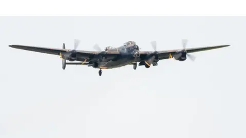 Lancaster bomber PA474 takes off from her home base of RAF Coningsby in Lincolnshire