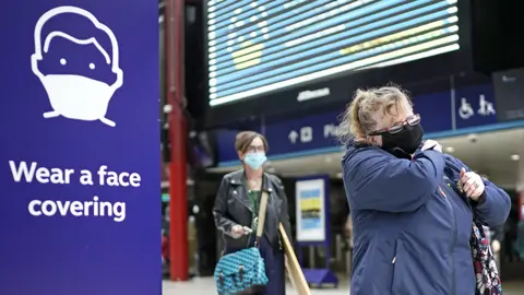 Getty Images People wear face masks at the train station on July 14, 2020 in Liverpool