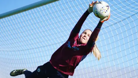 Getty Images Ellie Roebuck making a diving save