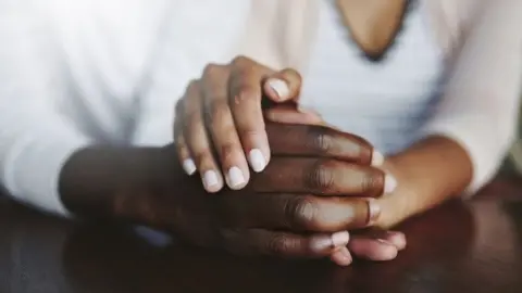 Getty Images Holding hands