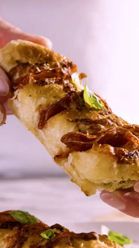 A stick of garlic bread with filling