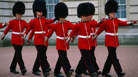 Getty Images Guards marching extracurricular  Buckingham Palace