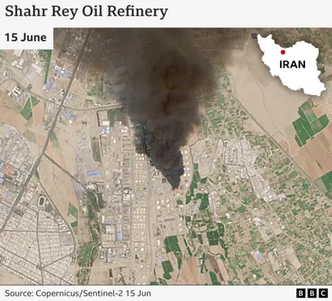 Satellite image of Shahr Rey Oil Refinery with large cloud of black smoke rising. Iran map locator top right.