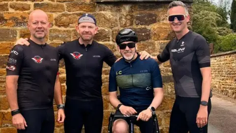 Supplied Four men pictured together while wearing cycling gear.