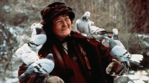 20th Century Fox/Kobal/Shutterstock Brenda Fricker with several birds perched on her arms in a scene from Home Alone 2