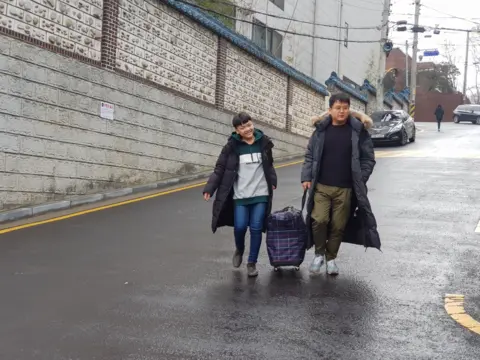 Handout Geumseong arriving to his new home with his foster father in Seoul in 2019