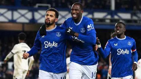 Everton players celebrate