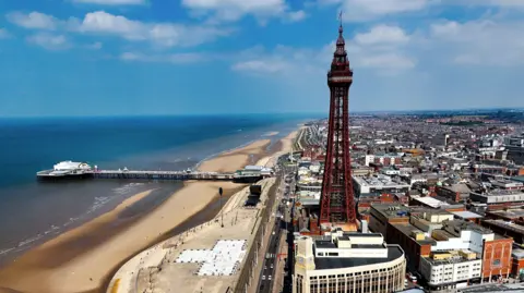 PA View of Blackpool from the air, showing the beach, Blackpool Tower and the piers 