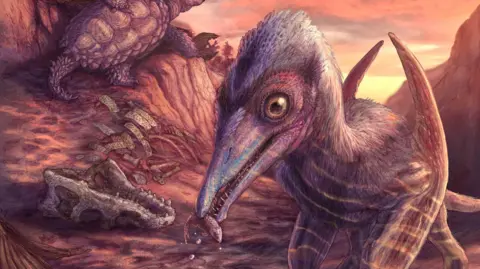 Smithsonian The image is an artist's impression of the ancient winged reptile that scientists have discovered at a site that, 200 million years ago, was a riverbed. The image depicts a creature with a long, pointed jaw and wings folded in at its sides. It has its clawed feet submerged in the water of the river and appears to have caught a small amphibian in its mouth.