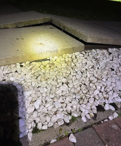 Mining Remediation Authority Raised flagstones with small stone chips in front on a doorstep