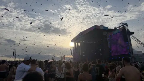 A crowd gathers in front of BBC Radio 1's main stage.