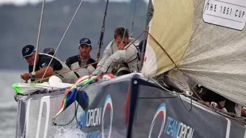Getty Images  The skipper of TeamOrigin Ben Ainslie sails against the American team's BMW Oracle in the America's Cup Race at the Cowes Week Regatta 2010 