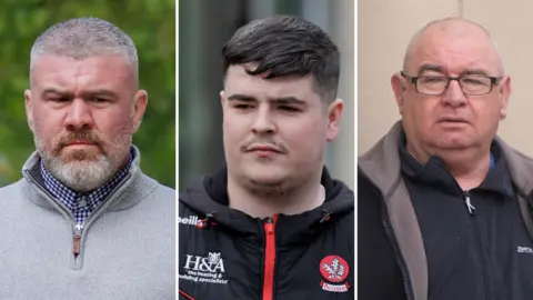 PA Media This is a composite image of three men.
Peter Cavanagh - a middle aged man with grey hair and a grey beard. He is wearing a grey quarter zip jumper over a blue and white checked shirt.
Jordan Devine has short black hair with some grey in it and a black moustache and goatee type beard. He is wearing a black zip up jacket with a red zip.
Paul McIntyre is a man with grey, thinning hair. He is clean shaven and wears glasses.