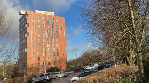 Photograph of tower block in Manchester, where the lift has broken 