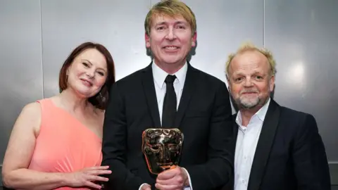 Getty Images Monica Dolan, James Strong and Toby Jones, winners of the Limited Drama Award for 'Mr Bates vs The Post Office', pose backstage during the 2025 BAFTA Television Awards with P&O Cruises at The Royal Festival Hall on May 11, 2025 in London, England.