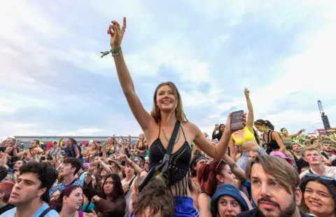 Jo Hale/Redferns via Getty Images Charli XCX Fans in the crowd at Reading Festival day 3 on August 28, 2022 in Reading, England. 