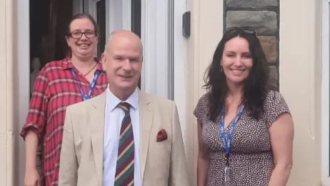 Avon and Somerset Police and Crime Commissioner  People gathered on a doorstep