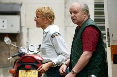PA Tony Martin arriving for a court appearance in October 2001