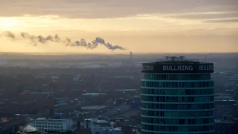 BBC Birmingham skyline with the Rotunda building in the foreground that says Bullring.