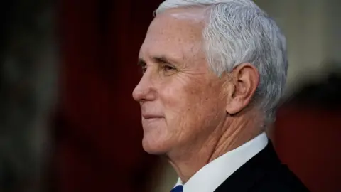 Getty Images/Pool Vice President Mike Pence finishes a swearing-in ceremony for senators in the Old Senate Chamber on Capitol Hill on January 3, 2021