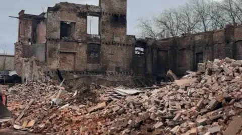 Liv Flanagan A huge pile of bricks and a skeletal building