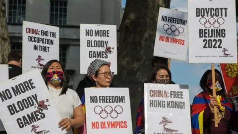 Getty Images Free Tibet campaigners and members of the Hong Kong, Tibetan and Uyghur communities hold protest in 2021