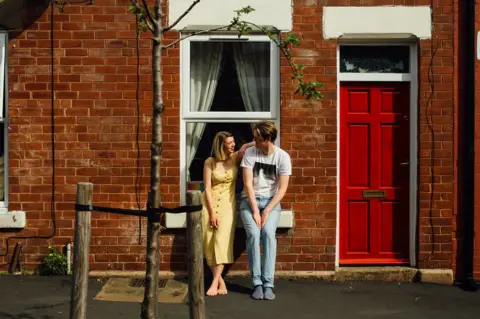 Ellie Grace Photography Doorstep portrait of Emma and Pete in Sharrow