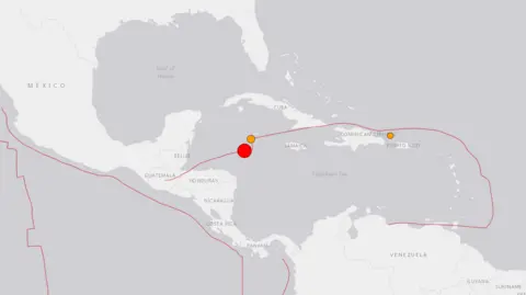 USGS A map showing a red dot, in the Caribbean Sea near north-east of Honduras, where the earthquake was recorded