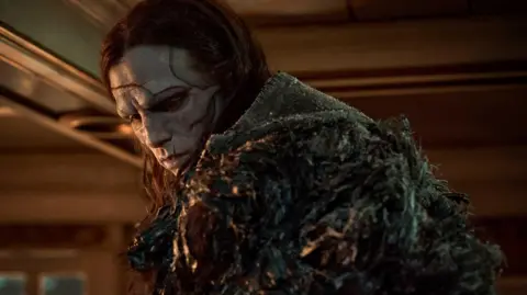 Netflix Jacob Elordi with long hair and scars on his face as Frankenstein's monster