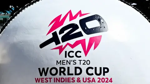 A giant white cricket ball with the branding for the ICC Men's T20 World Cup in West Indies and USA 2024 on