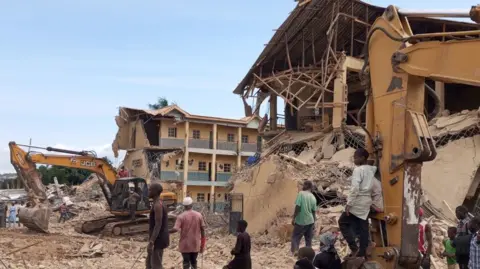 A picture of the collapsed school building in Nigeria