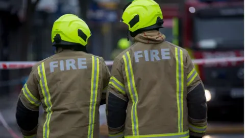 Getty Images Firefighters attend a fire in premises on the Walworth Road