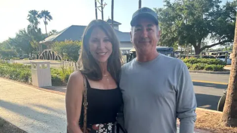 Terri Emery and Scott Morgan smile