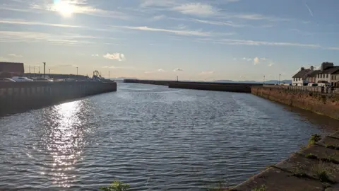 BBC A general view of Maryport Harbour in the early evening
