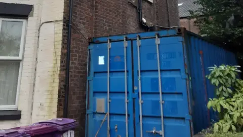 Liverpool Council A shipping container at a property in Belmont Drive, Kensington