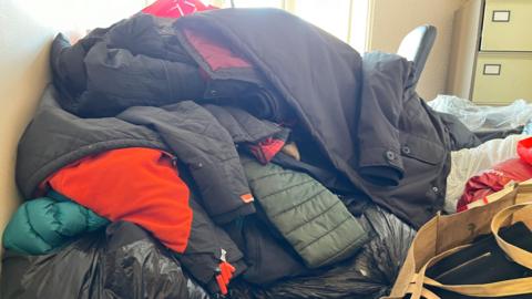 A pile of coats collected in Leek