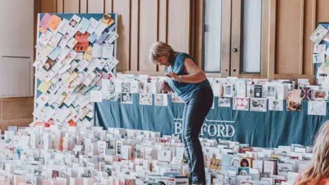 Bedford School  Volunteers helping open cards