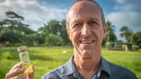 Chris Morgan/ BBC Dr Vincent Lebot outside his lab in Port Vila
