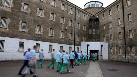 Corbis via Getty Images Prisoners return from their jobs to their wings for lunch at Wandsworth prison. HMP Wandsworth in South West London
