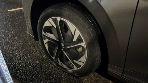 Sarah Dillow A flat tyre of an MG car