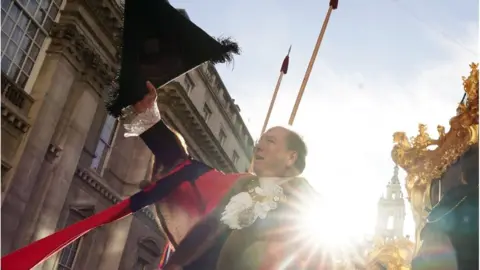 PA Media Michael Mainelli, the 695th Lord Mayor of the City of London, waves from the State Coach during the Lord Mayor's Show