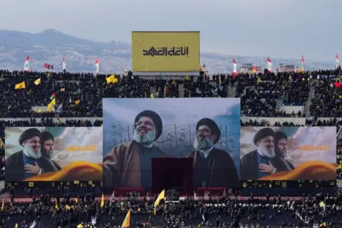 Reuters two massive posters suspended above a crowd