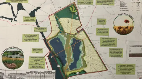 Cemex/Worcestershire County Council A pinned up printout shows what the future wetland would look like after quarrying is complete.