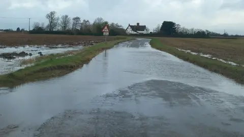 Shell Steggles Flooded road in Mickfield, Suffolk